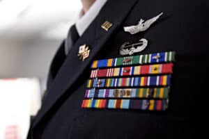 featured image shows a military uniform lapel with honor bars