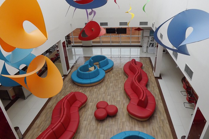 FEatured image showing the colorful selection of couches meant to entertain children and their families at Hospital de Cancer de Barretos, Children’s Hospital